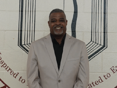 man standing in front of white wall